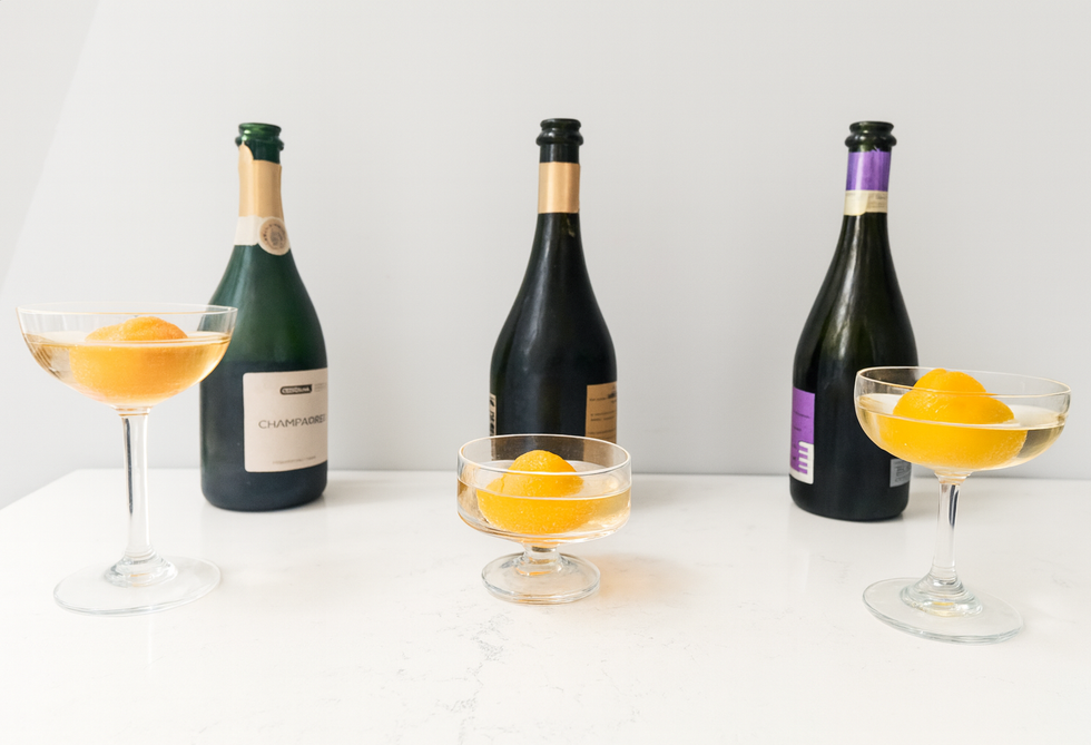meghan markle champagne float testing with champagne, cava, and prosecco in three different coupes