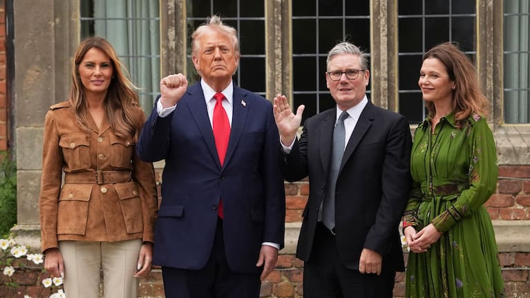 President Donald Trump and Britain's Prime Minister Keir Starmer gesture next to first lady Melania Trump and Victoria Starmer.