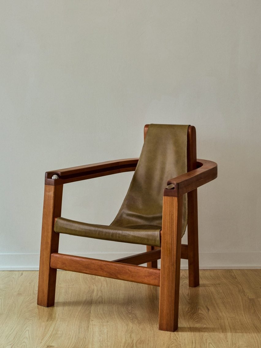 Chair with metal ball integrated into arm