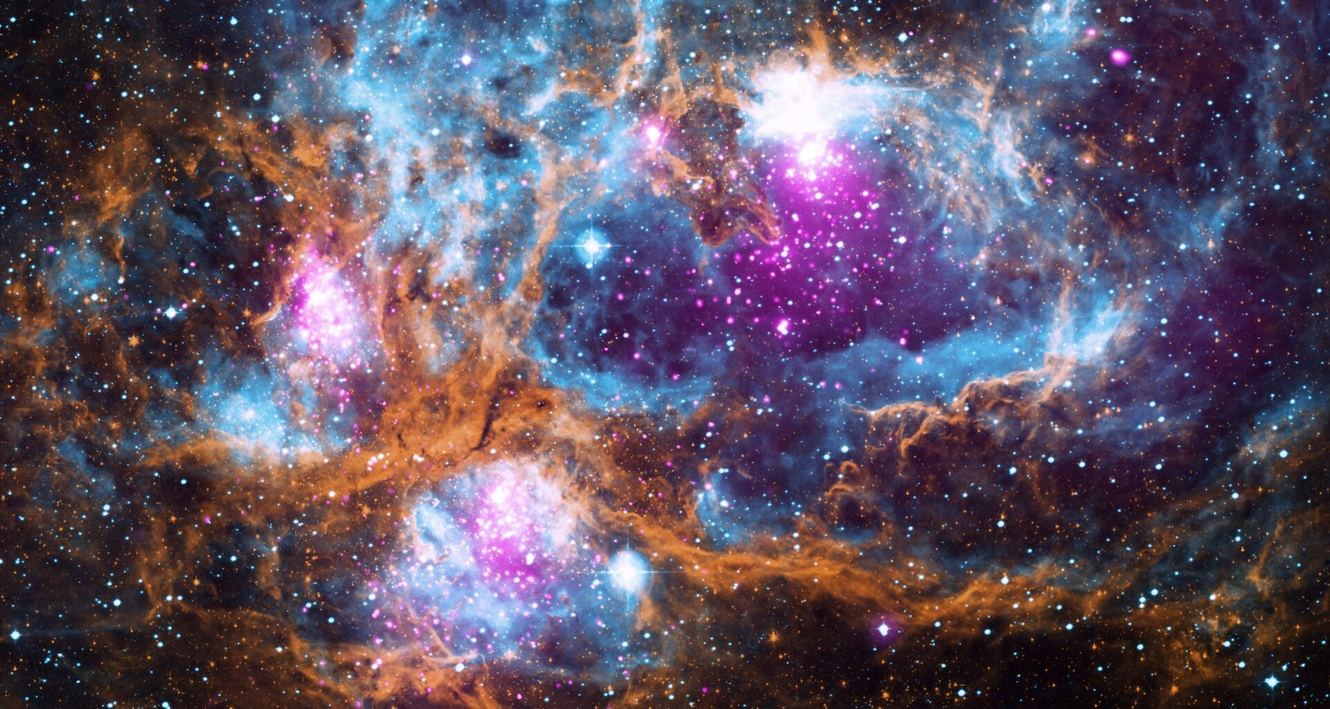 An image of a colorful cloudy star-forming region