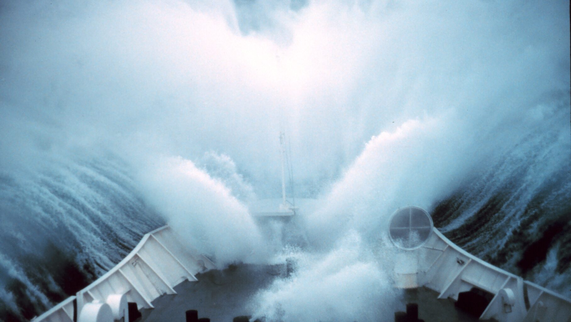 A ship plows through rough seas in the Bering Sea