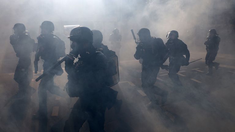 Police charge during a demonstration in Paris. Pic: Reuters