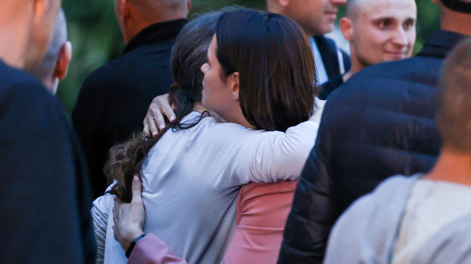 Belarusian opposition leader Sviatlana Tsikhanouskaya welcomes freed prisoners, as they arrive at the US embassy in Vilnius. Pic: Reuters