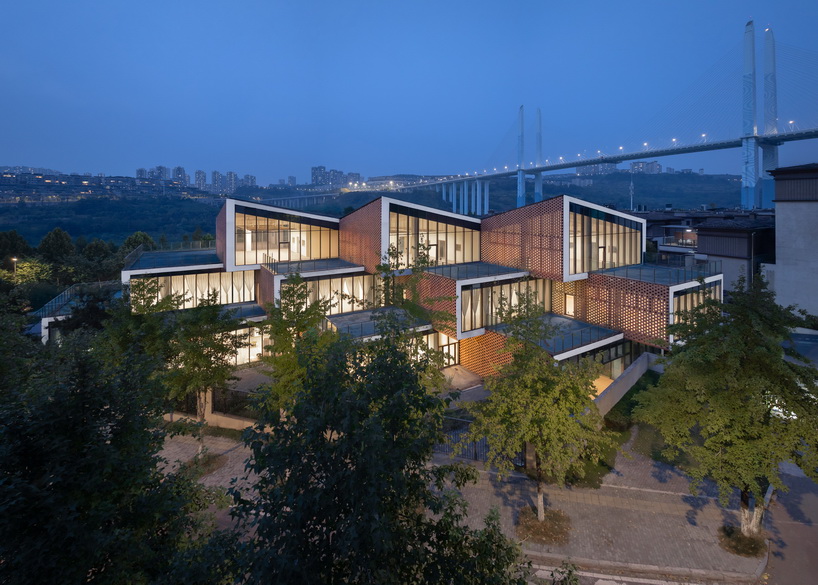 permeable terracotta brick screens wrap kindergarten's stacked volumes by NAN architects