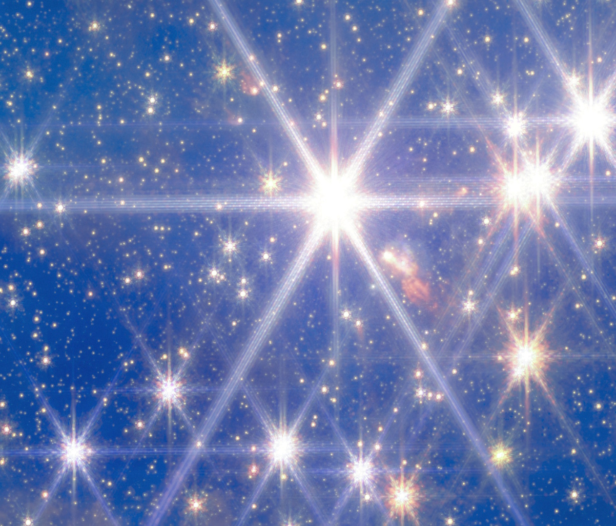 A dense field of bright stars, resembling Hubble or JWST images, shines against a deep blue background, with several stars displaying prominent diffraction spikes—evoking the splendor of clusters like Pismis 24.