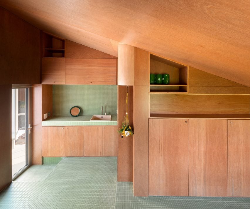 Green-tiled interior at Pojeon House by Sukchulmok and BRBB Architects