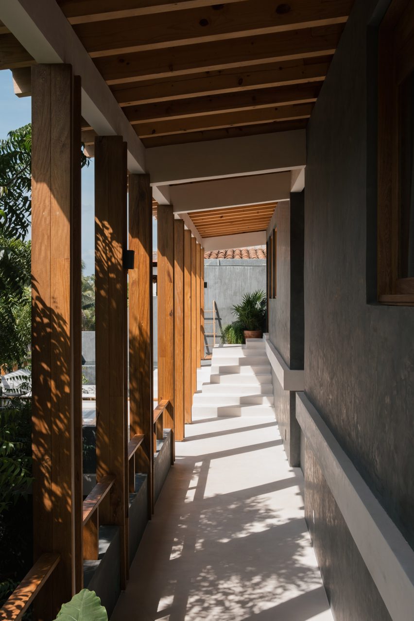 Breezeway along a dark grey chukum building