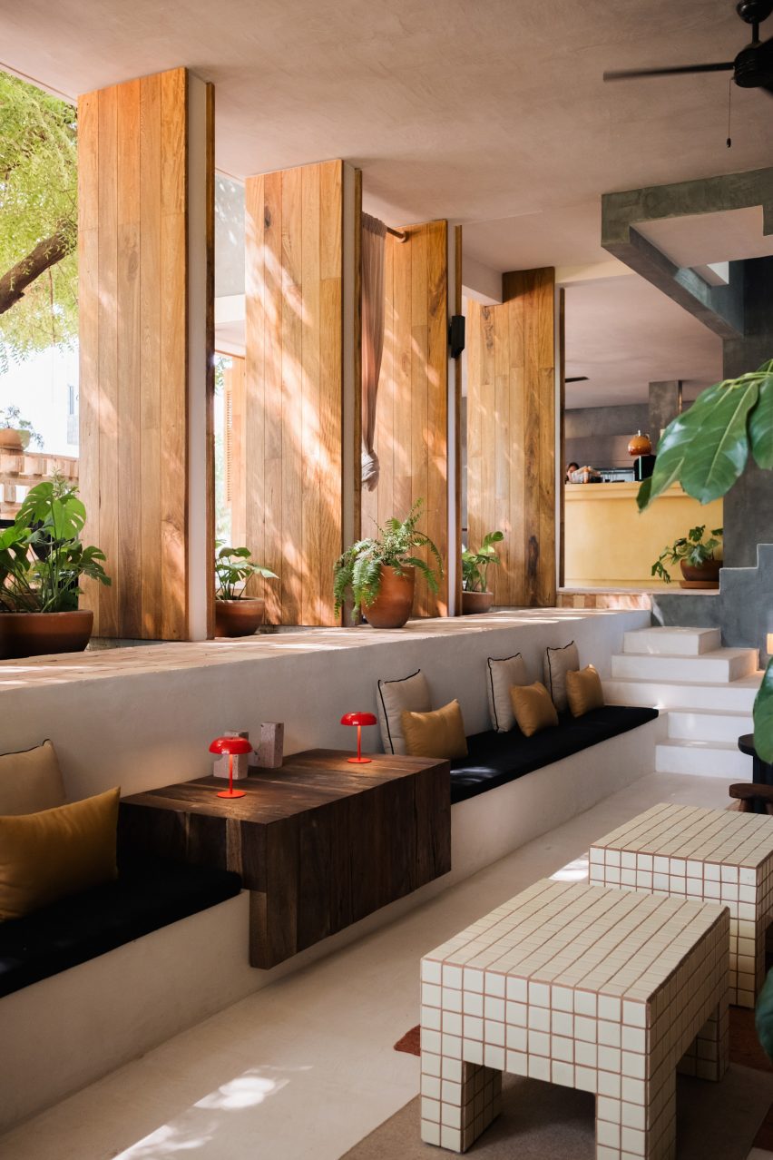 Large wood-wrapped louvres above a sunken lounge