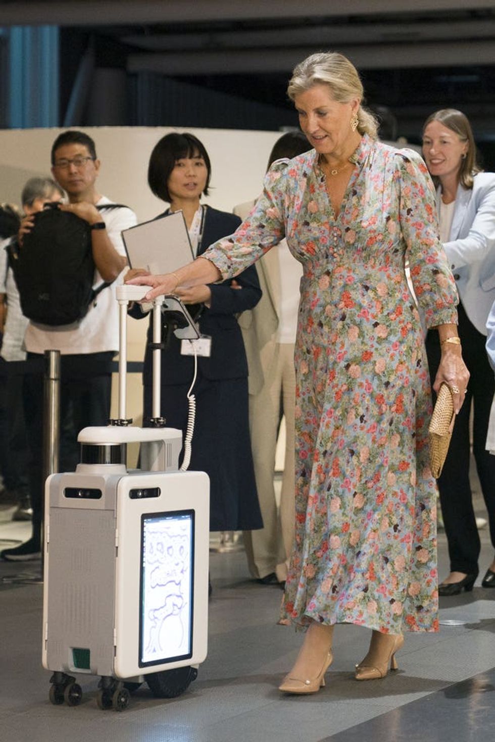 The Duchess of Edinburgh trying an AI suitcase