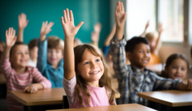 children raising their arms