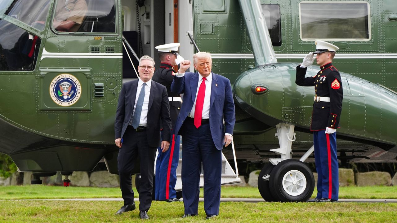 U.S. President Donald Trump, centre right, and British Prime Minister Keir Starmer arrive at Trump International Golf Links in Aberdeenshire, Scotland, Monday, July 28, 2025. (Jane Barlow/Pool Photo via AP, file)