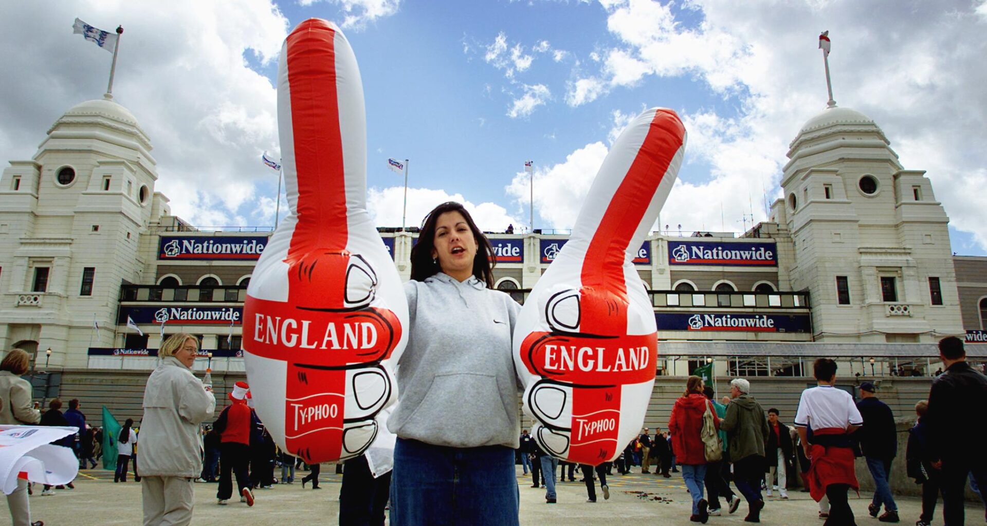 An England fan with inflatable thumbs at Wembley Stadium, 2000