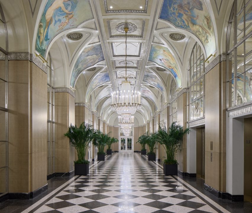 Grand corridor with mirrored panels and ceiling murals