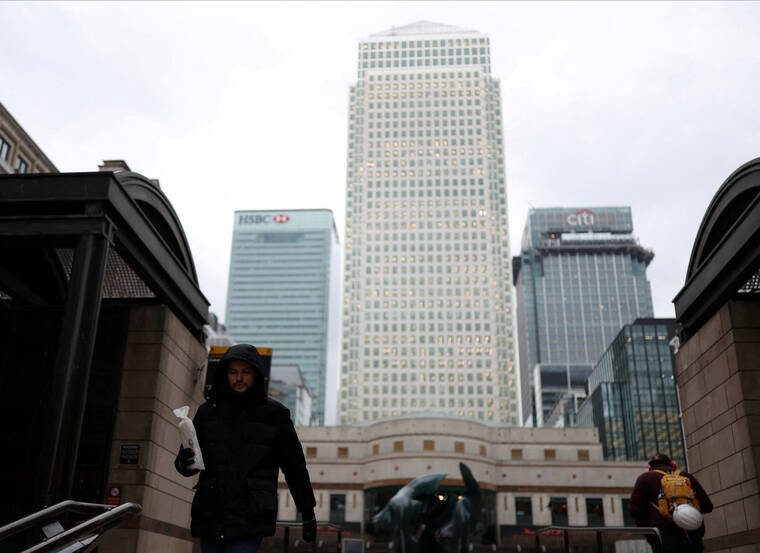REUTERS/ISABEL INFANTES / FEB. 13
                                Citis tower is seen at right as workers walk through Cabot Square in Canary Wharf financial district, London, Britain.