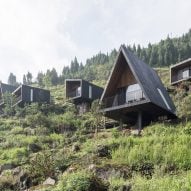 Different shaped cabins placed along a mountain terrain