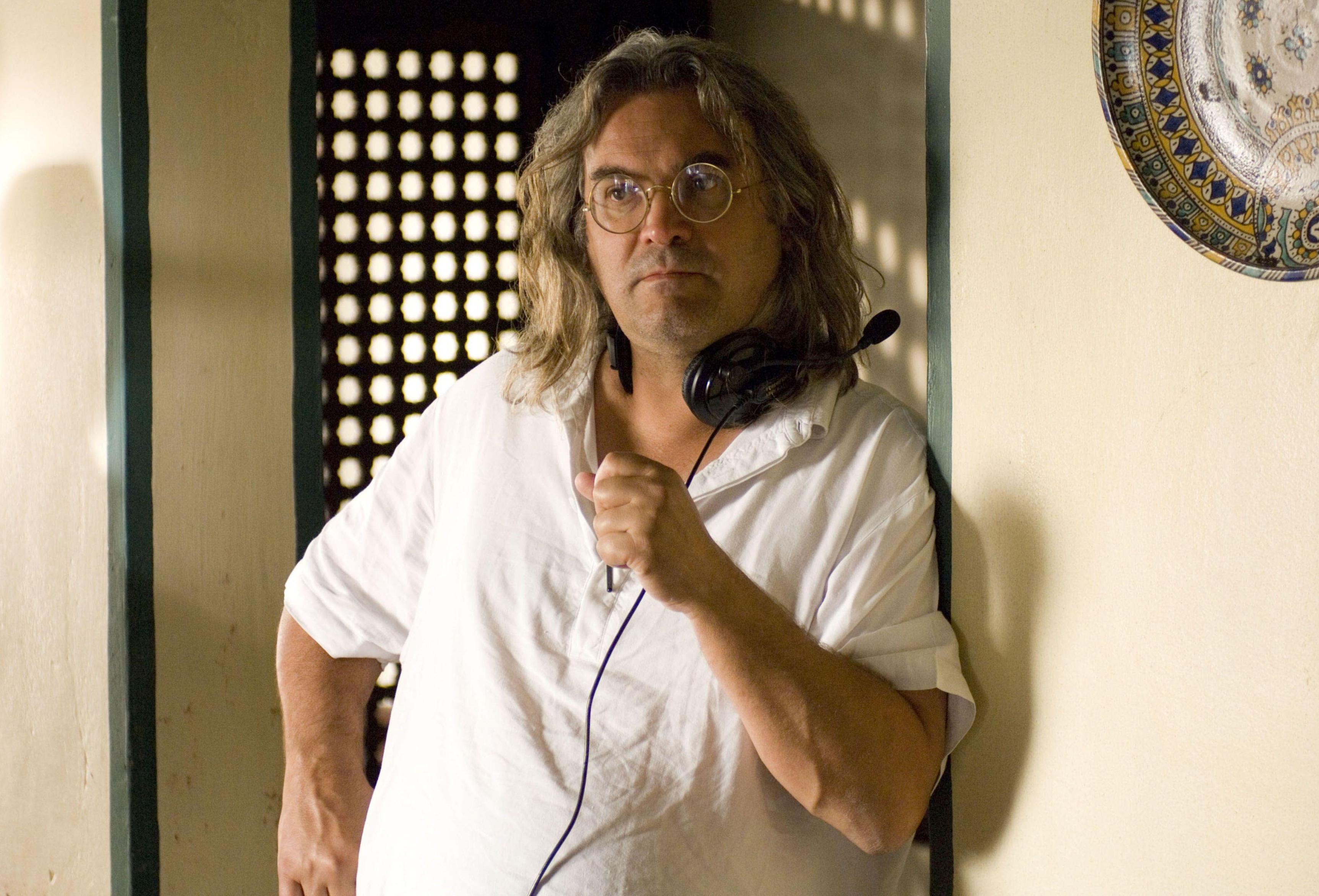 Paul Greengrass, director of The Bourne Ultimatum, wearing headphones.