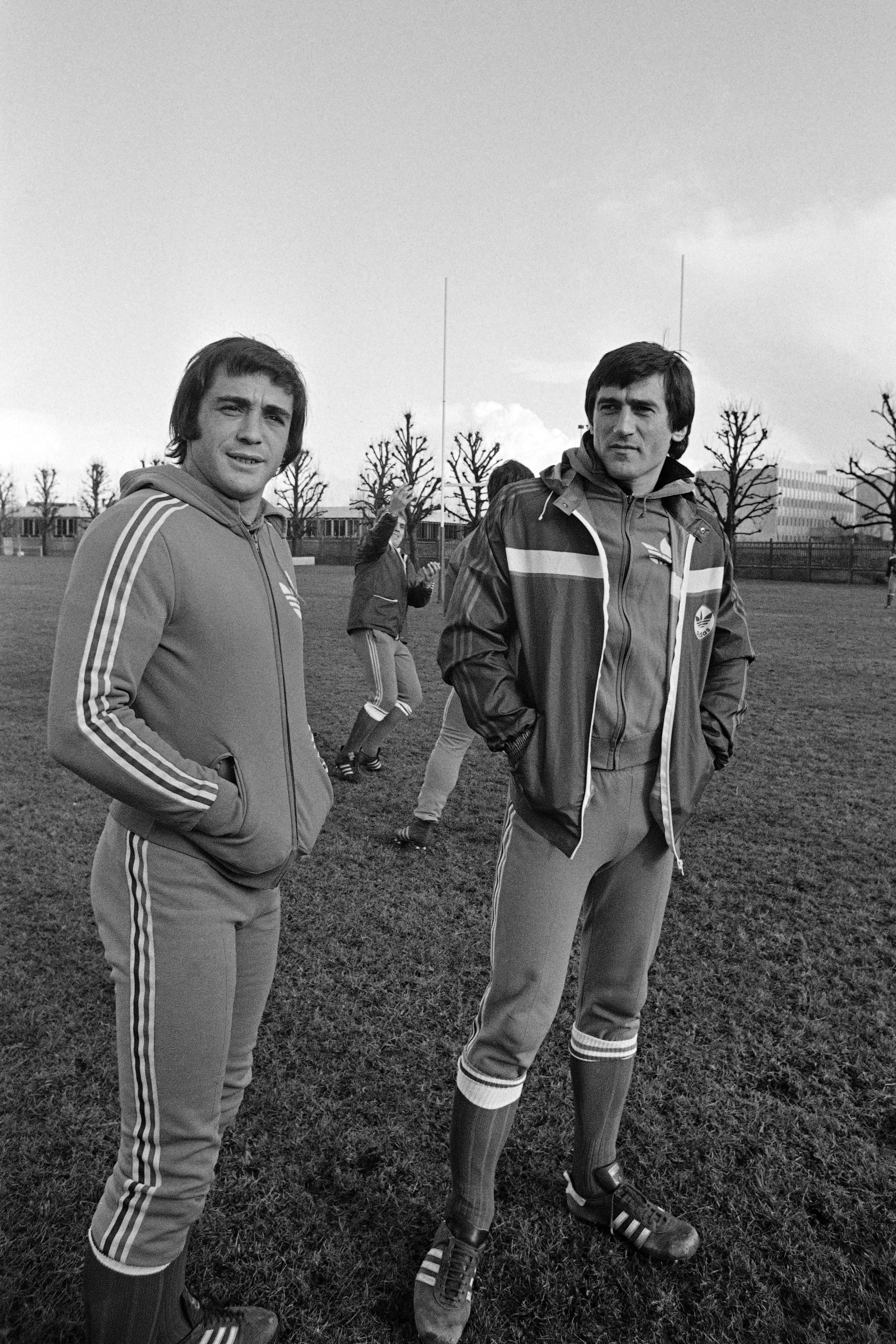 French rugby union international Guy Laporte (R) speaks with teammate Roland Bertranne during a national team training session.