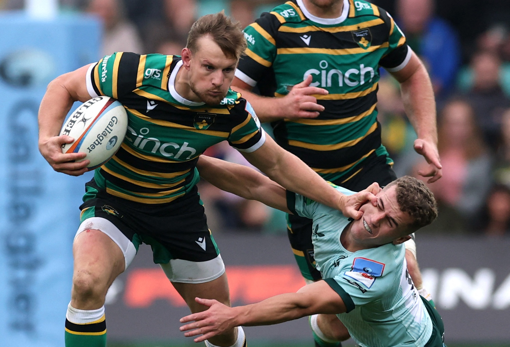 Northampton Saints' Rory Hutchinson in action with Leicester Tigers' Billy Searle.