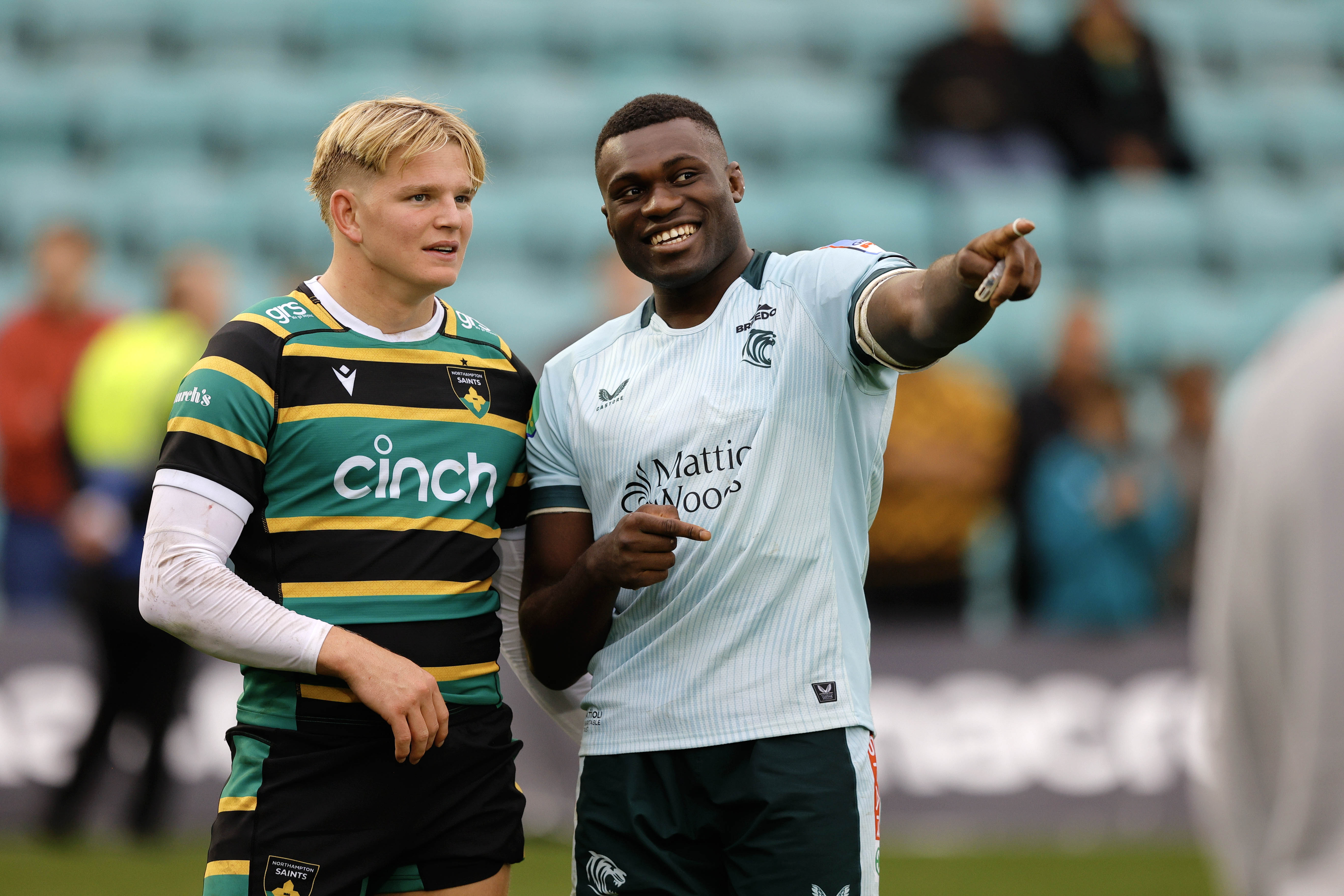 Henry Pollock of Northampton Saints chatting with Emeka Ilione of Leicester Tigers.