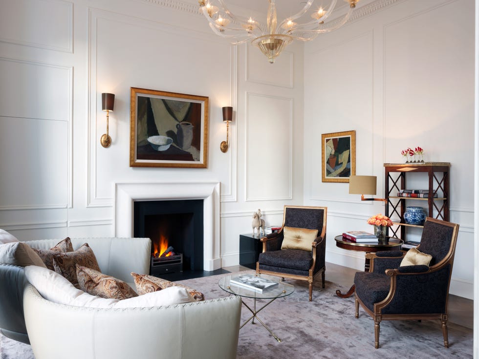 Elegant living room featuring a fireplace, seating area, and decorative elements.