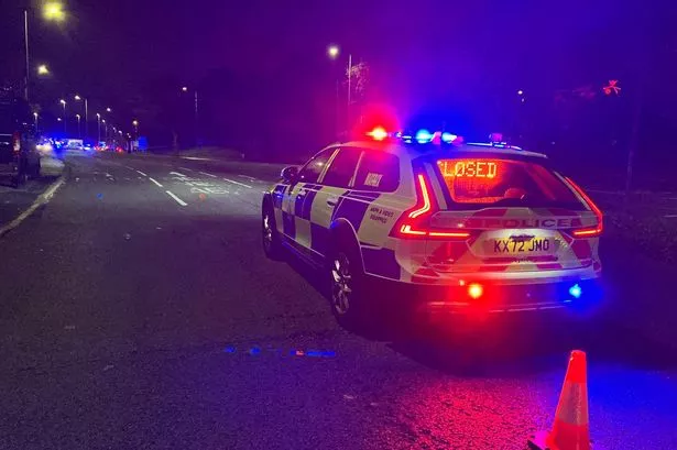 A silver Seat Leon car has collided with a lamp post at the junction of Liverpool Road and Kings Drive roundabout in Prescot