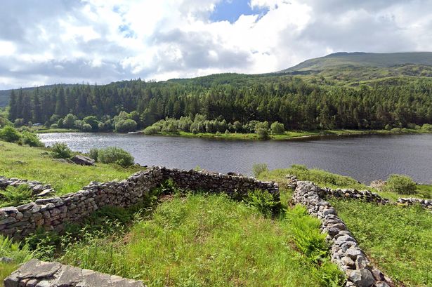 The view across Llynnau Mymbyr towards Coed Bryn-Engan, near Capel Curig. Beyond is Moel Siabod