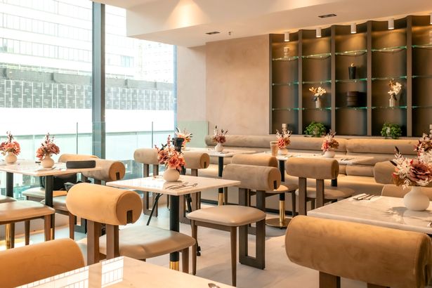 The venue has been decorated with a warm cream and dark chocolate palette