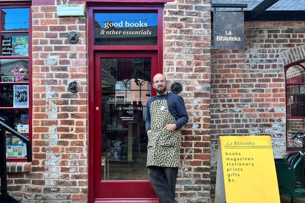 Alex Maxwell outside his bookstore, La Biblioteka