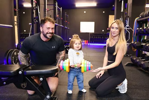 Chris McKinney with Rebecca and her daughter Elema at Apex Performance Health and Fitness on the Serpentine Road, Belfast.