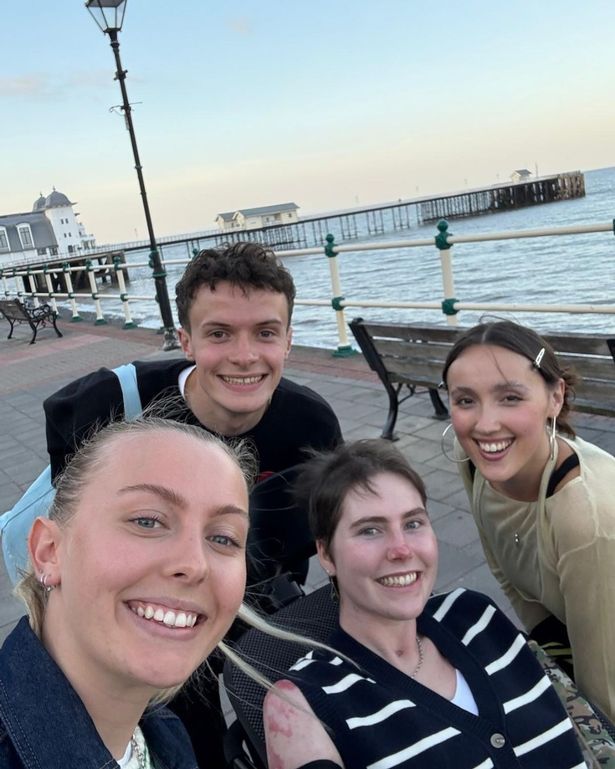 A group of people near the seaside