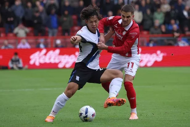 Birmingham City's Tomoki Iwata and Bristol City's Anis Mehmeti