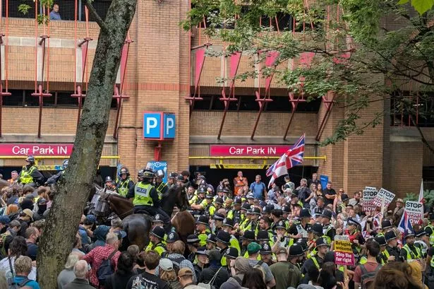 The scene on Newgate, Bristol, as protesters and police fill the street