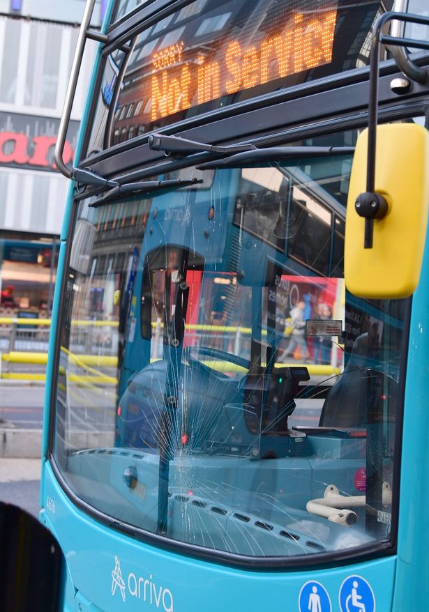 A double decker Arriva bus with its windscreen shattered