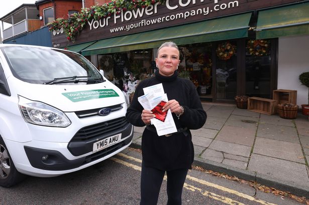 Claire Smithwick, owner of Your Flower Company, with a few of her recent parking tickets
