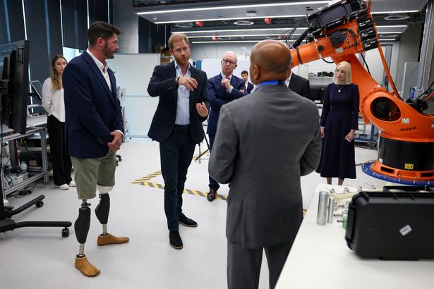 The Duke of Sussex (centre) with former army captain and paralympian David Henson (left), meets healthcare and research professionals during a visit to Imperial College London's Centre for Blast Injury Studies, at Sir Michael Uren Hub in White City, west London. Picture date: Wednesday September 10, 2025. PA Photo. Photo credit should read: Suzanne Plunkett/PA Wire