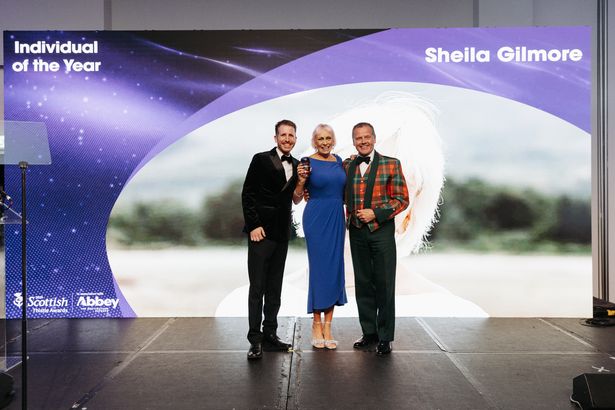 Individual of the Year Sheila Gilmore from VisitArran with award host Garry Spence and VisitScotland Chair Stephen Leckie