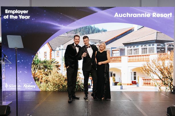 Award host Garry Spence, Garrie Ross from Auchrannie Resort, and Barbara Smith from VisitScotland