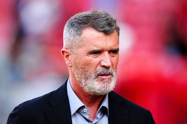 Roy Keane looks on