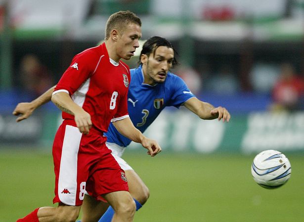 Craig Bellamy is closed down by Gianluca Zambrotta during Wales' 4-0 defeat at the San Siro in 2003