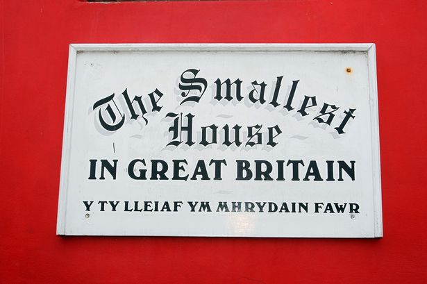 FILE PICTURE A sign proclaiming this building as The Smallest House in Great Britain on Conwy Quay. Image: David Powell/North Wales Live