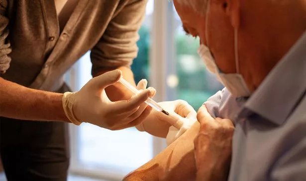 A man getting the flu jab