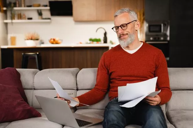 Man reading letter, worried