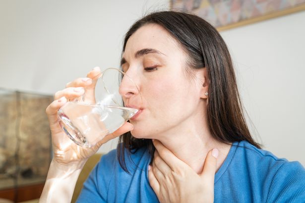 Woman with sore throat