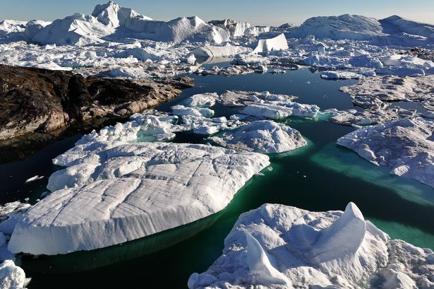  In this aerial view melting icebergs crowd the Ilulissat Icefjord on July 16, 2024 near Ilulissat, Greenland. 