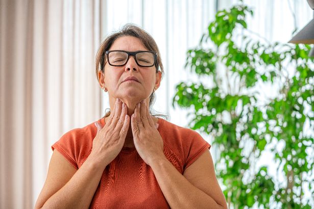 Woman with sore throat