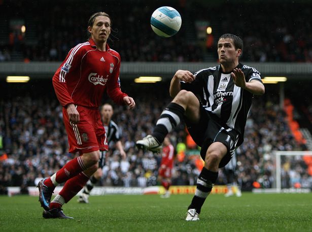 Michael Owen of Newcastle United in action with Lucas of Liverpool during the Barclays Premier League match between Liverpool and  Newcastle United at Anfield on March 8, 2008 in Liverpool, England. 