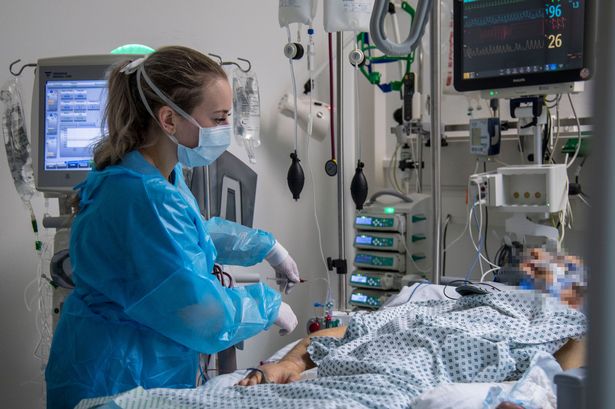 A nurse in a face mask