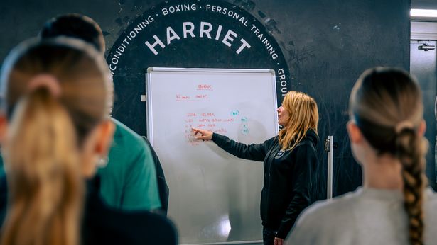 Harriet McGuffie inside her gym hosting one of her many fitness events