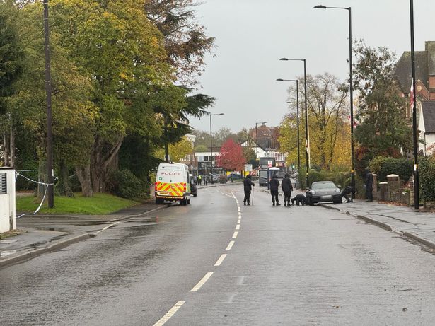 Police search officers paid particular attention to a Porsche at the side of Birmingham Road and even set the vehicle's alarm off while searching by it