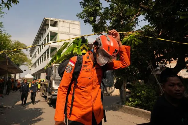 slamic boarding school where a building collapsed in Sidoarjo, East Java, Indonesia,